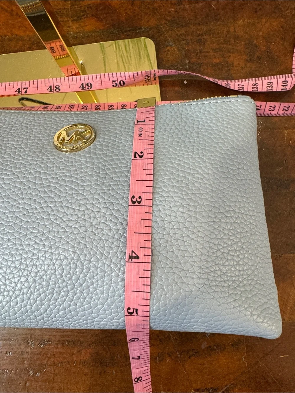 Michael Kors Light Blue Pebbled Leather Cosmetic Pouch with Gold MK Emblem